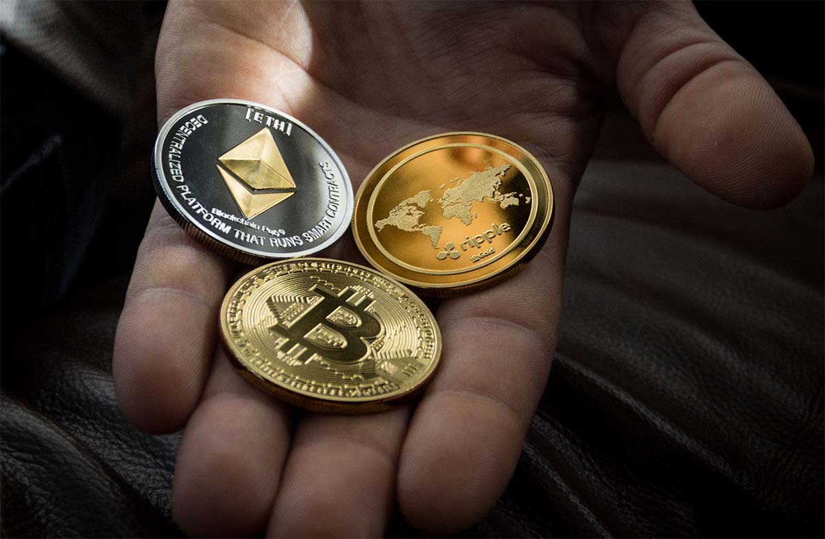 Bitcoins in a hand. What Is Cryptocurrency? Mydollarbills
